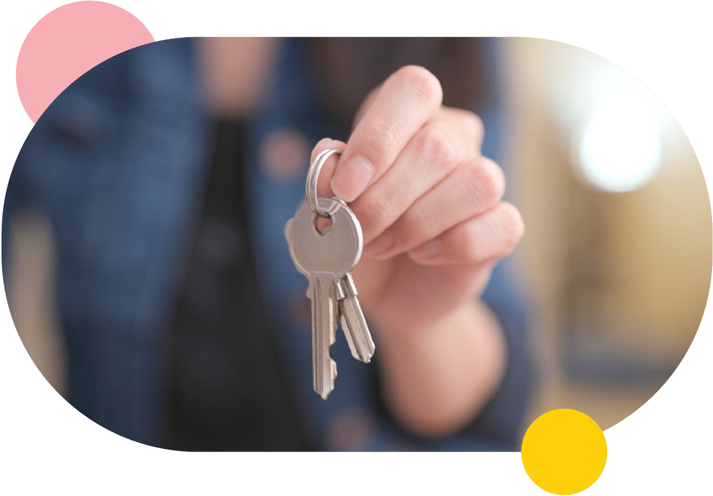 A woman holding a key to a rental property.